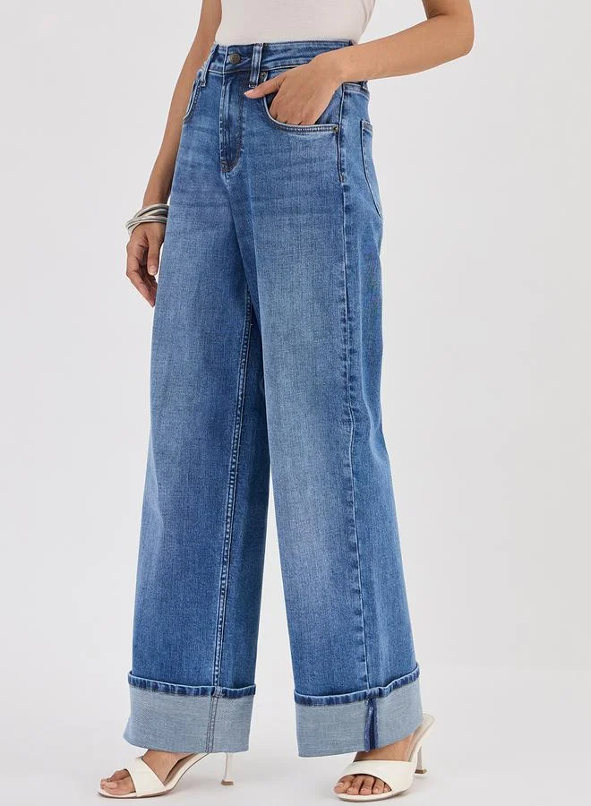 فيميلا جينز بأرجل واسعة وخصر متوسط