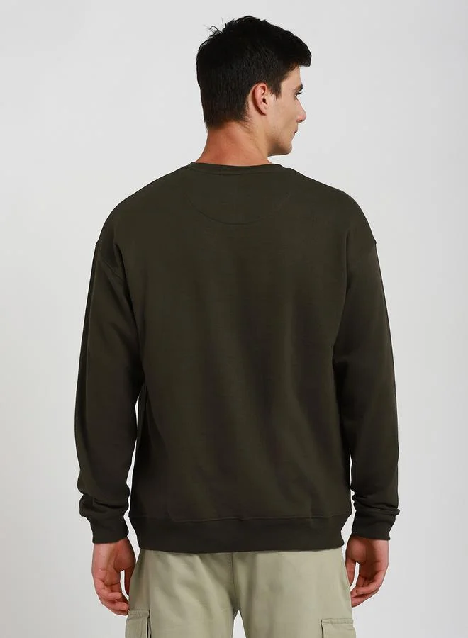 Dennis Lingo Relaxed Fit Solid Sweatshirt with Dropped Shoulder by Styli