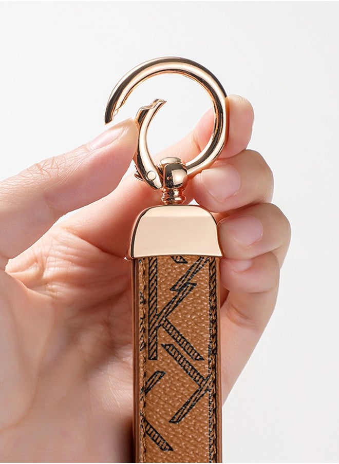KeyAmor - Elegant metal and leather keychain car key holder for adults. Stylish keychain with golden rings, perfect for women, featuring 3 key rings for added functionality. Made with elegant and refined light brown leather, it offers 360-degree rotation for convenience and comes beautifully packaged in a fancy gift box, making it an excellent accessory or gift choice. - Image 1