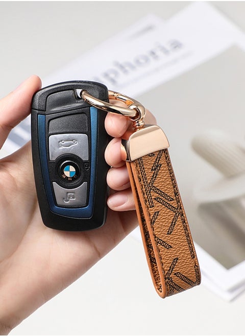 Elegant metal and leather keychain car key holder for adults. Stylish keychain with golden rings, perfect for women, featuring 3 key rings for added functionality. Made with elegant and refined light brown leather, it offers 360-degree rotation for convenience and comes beautifully packaged in a fancy gift box, making it an excellent accessory or gift choice.