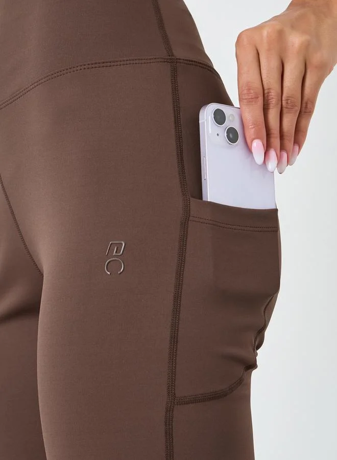 Styli Active  Women Rubber Logo Back Reflective Strip Flare Leggings for Women | Best Price UAE