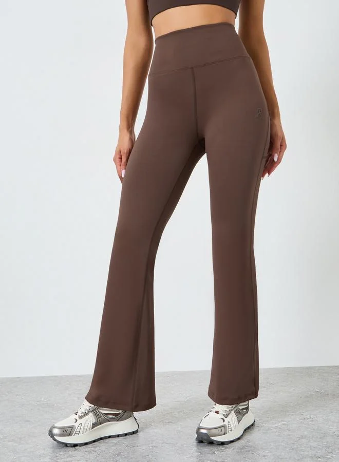 Styli Active  Women Rubber Logo Back Reflective Strip Flare Leggings for Women | Best Price UAE