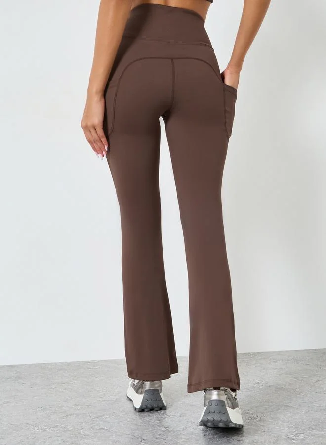 Styli Active  Women Rubber Logo Back Reflective Strip Flare Leggings for Women | Best Price UAE