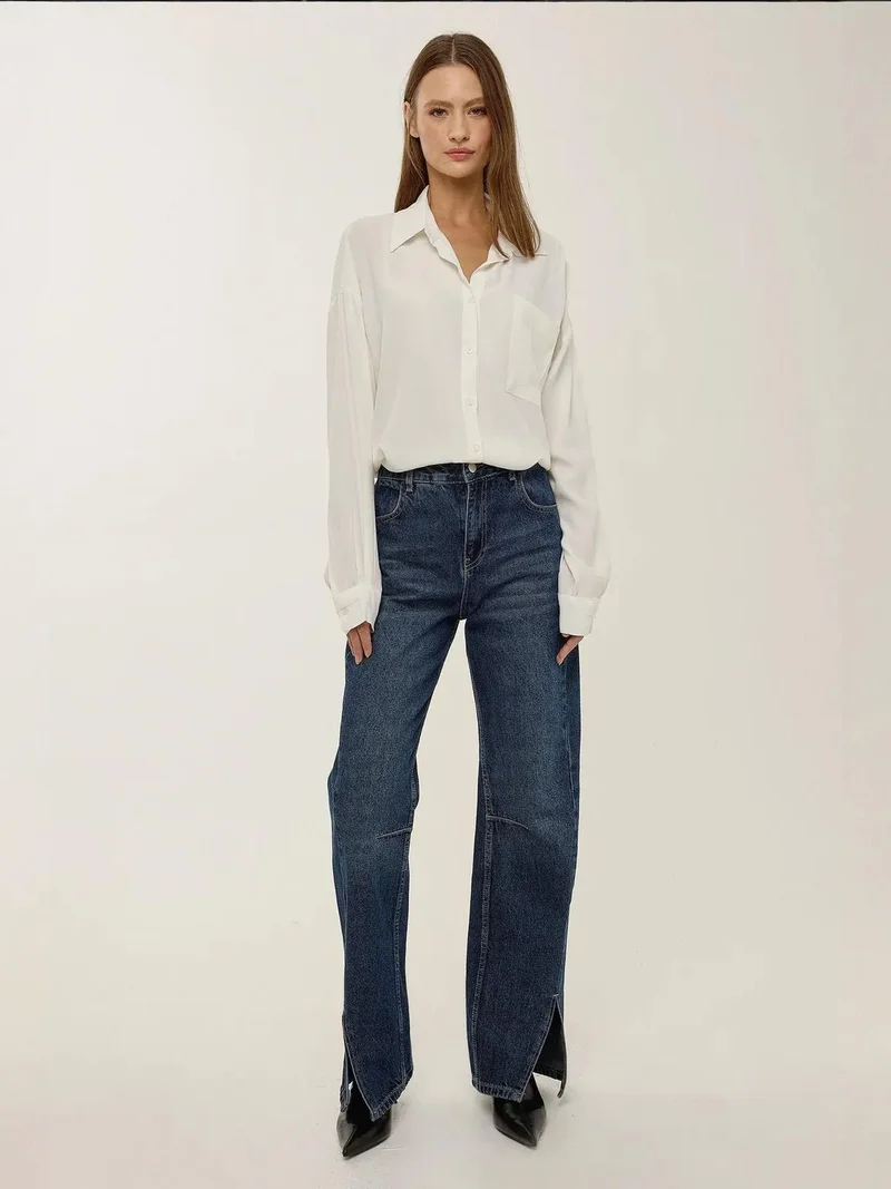 زوبعة قميص أبيض فضفاض