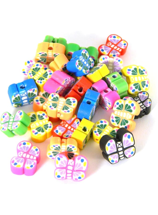 High quality handmade butterfly polymer clay beads in an of different colors and sizes. They measure 6-9mm in tall and 4-4.5mm thick with 1-1.2mm holes. The holes run from the top of the butterfly through to the bottom. Since these beads are handmade they all vary slightly. age of 30 beads. - Image 1
