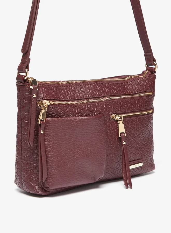 سيليست Women All-Over Monogram Embossed Crossbody Bag with Adjustable Strap and Zip Closure