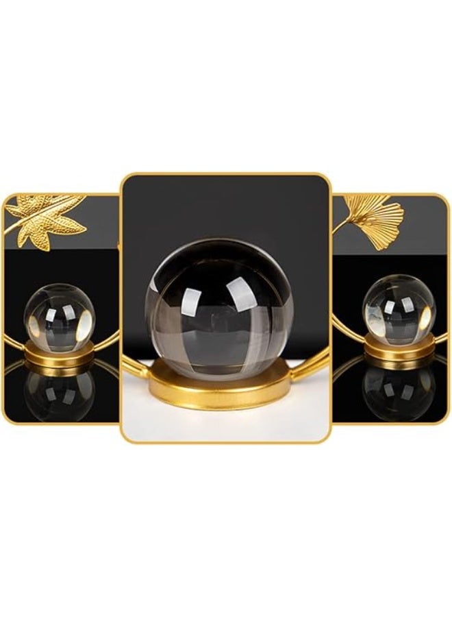 A decorative gold metal ornament with a circular design featuring a leaf and a clear crystal ball - a modern and elegant decoration for tables and shelves. - Image 4