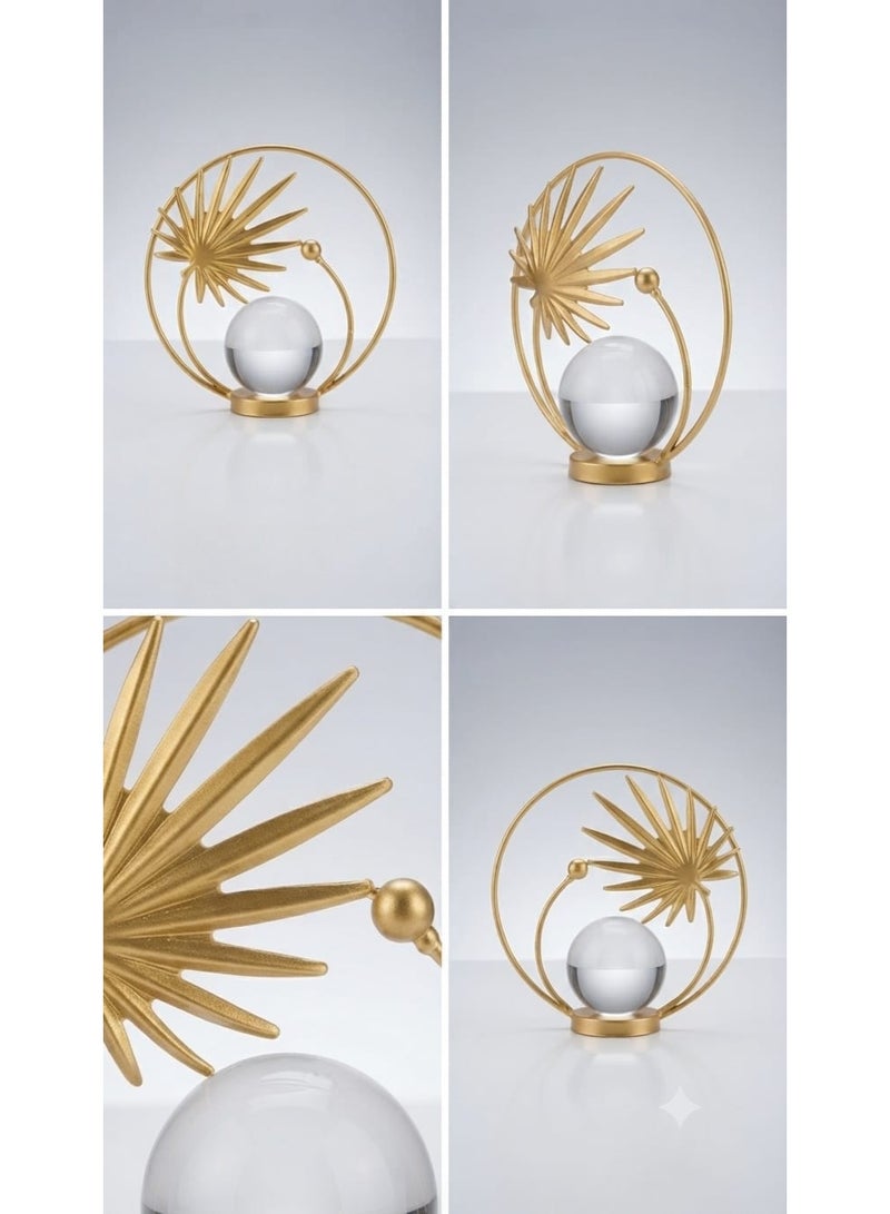 A decorative gold metal ornament with a circular design featuring a leaf and a clear crystal ball - a modern and elegant decoration for tables and shelves. - Image 3