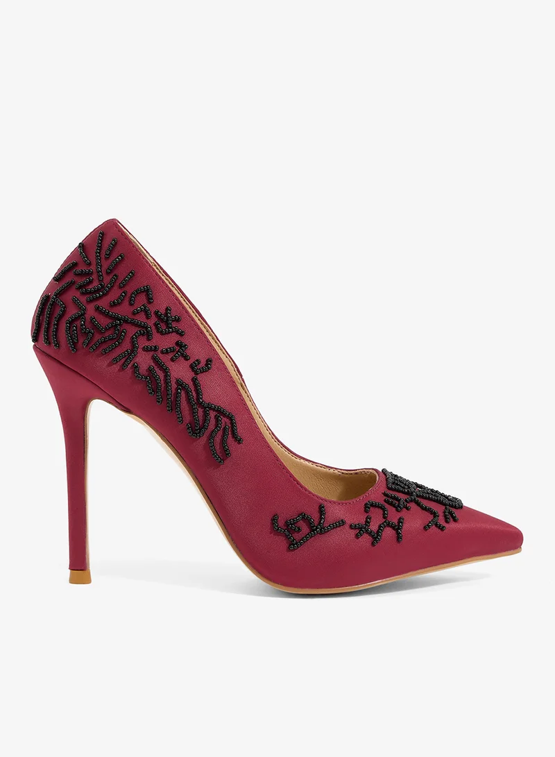 Burgundy satin pump with black floral beading, pointed toe, stiletto heel