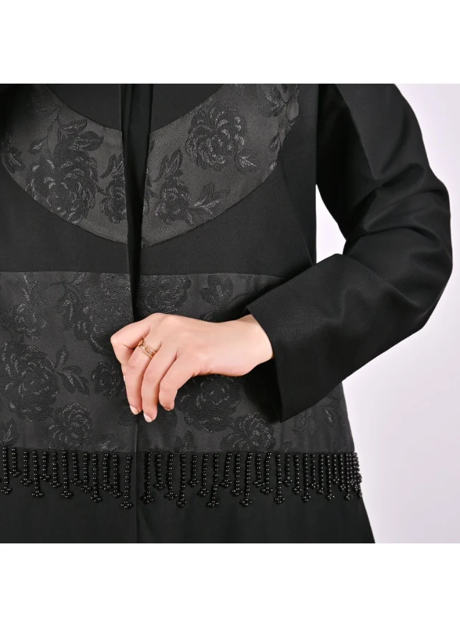 Hawraa Abaya Black wrap abaya with an elegant design, featuring floral jacquard paneling and embellished details