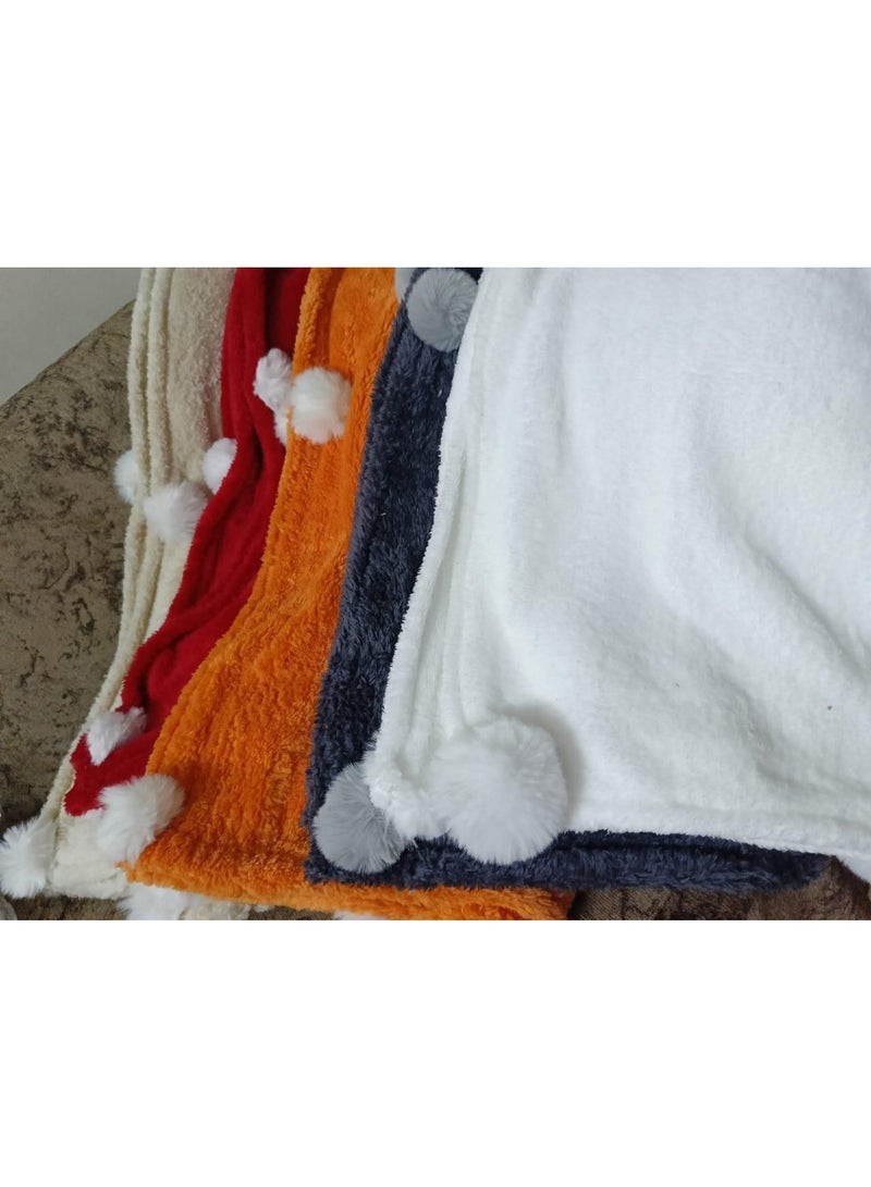 Exclusive and available now! Faux fur blanket adorned with plush pom-poms. Autumn and winter colors. We've also designed a matching rose-shaped cushion to add a touch of cheer to your home. Blanket size: 1 meter x 1.5 meters. Multiple colors available. - Image 2