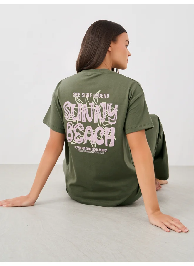 ستايلي Styli Unwind Beach Graphic Pocket Dropped Shoulder T-Shirt and Straight Pyjama Set