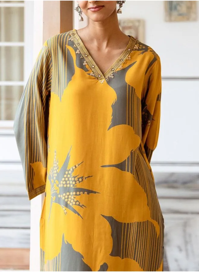 ISHIN Mid Rise Women Mustard Rayon Kurta Set with Embroidered pattern Tunic and Palazzo features a Round neckline and Three-Fourth Sleeve secured with Elastic closure and styled in Straight Fit ideal for Festive moments — crafted to elevate your special moments.