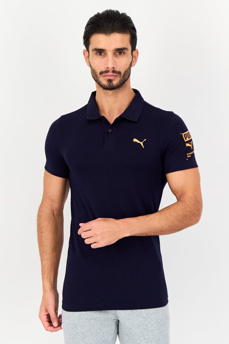 PUMA قميص بولو قصير الأكمام للرجال بتصميم ضيق مع شعار العلامة التجارية، أزرق داكن - Image 1