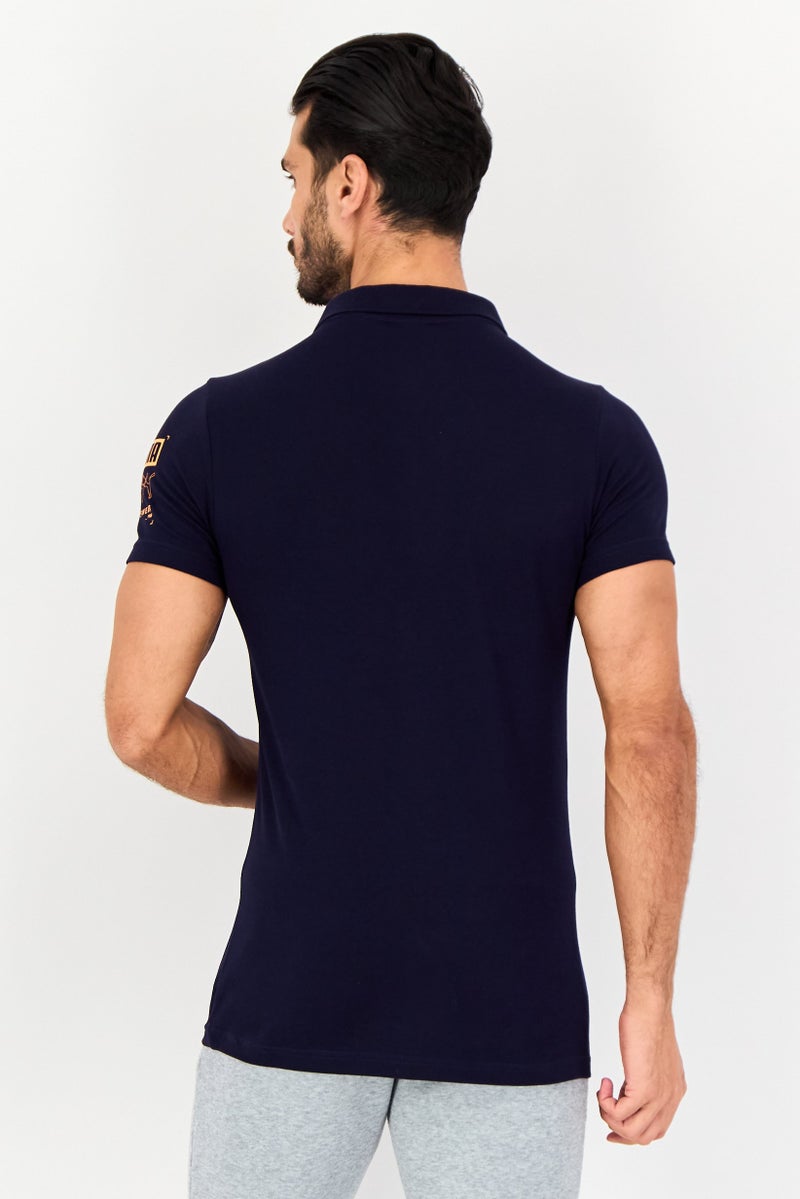 PUMA قميص بولو قصير الأكمام للرجال بتصميم ضيق مع شعار العلامة التجارية، أزرق داكن - Image 4