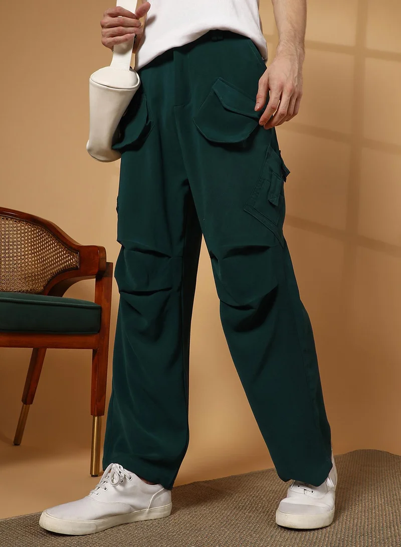 Campus Sutra Men's Emerald Green Asymmetrical Parachute Trousers For Casual Wear | 8 Pockets | Low-Rise | Button Closure | Cargo Pants Crafted With Comfort Fit For Everyday Wear