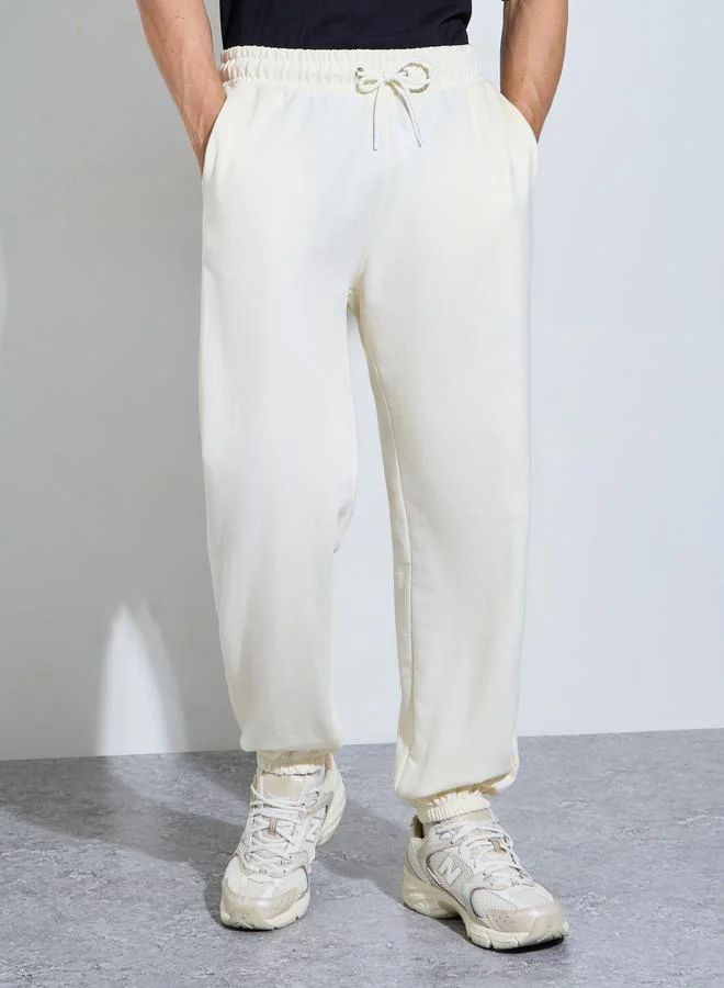 Styli Cream Solid Piping Pocket Relaxed Fit Jogger