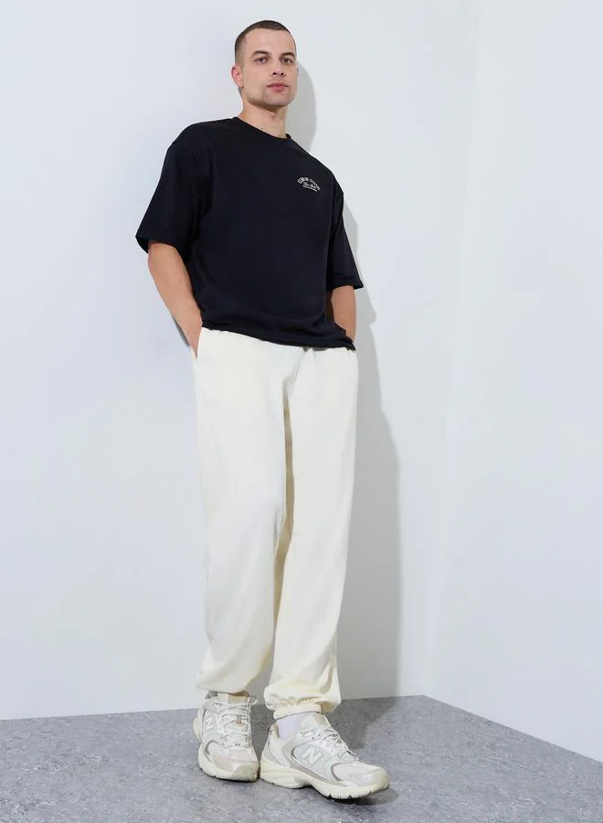 Styli Cream Solid Piping Pocket Relaxed Fit Jogger
