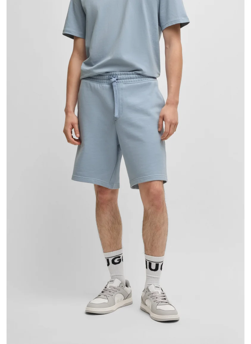 HUGO Relaxed-fit shorts in cotton terry with logo print