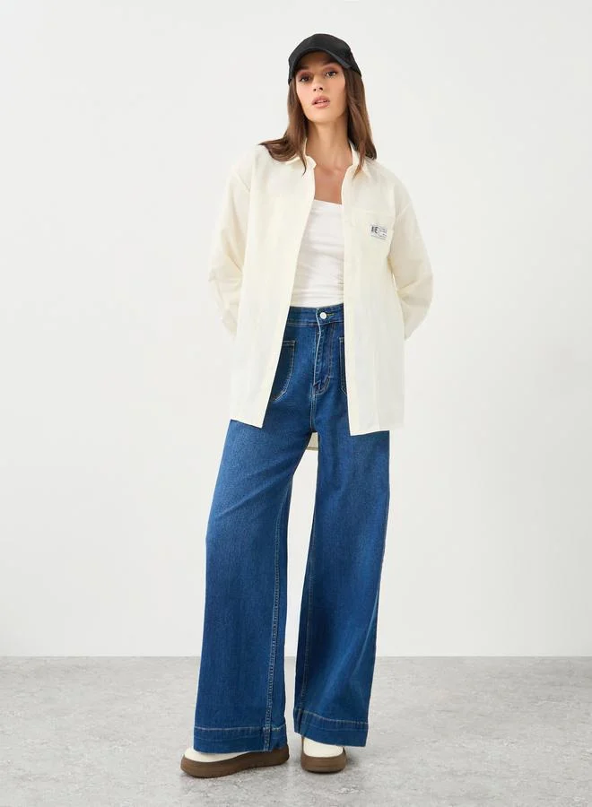 ستايلي Styli Women Cream High-Low Hem Shirt with Patch Detail
