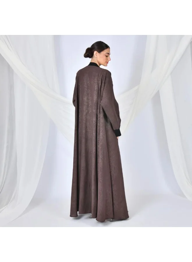 lamha abaya A brown quarter-length wrap abaya with a patterned summer jacquard fabric and black overlay on the sleeves and sides of the abaya.
