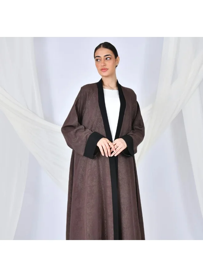 lamha abaya A brown quarter-length wrap abaya with a patterned summer jacquard fabric and black overlay on the sleeves and sides of the abaya.