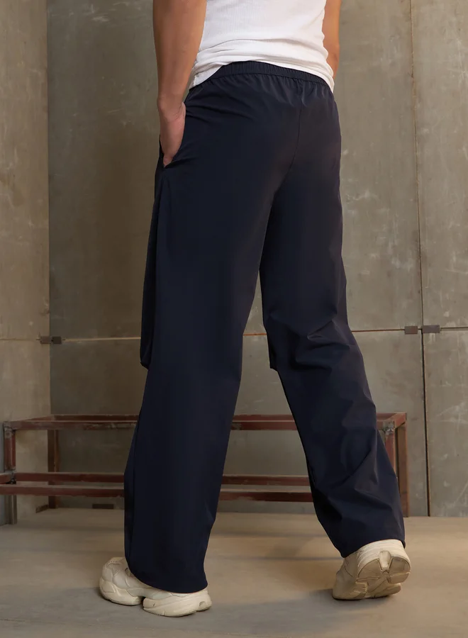 SASSAFRAS Solid Front Pleated Baggy Parachute Pants