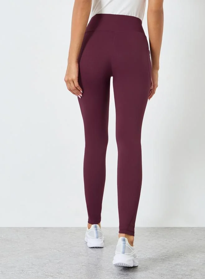 Styli Active  Women Calf Mesh Insert Rubber Logo 7/8 Leggings for Women | Best Price UAE