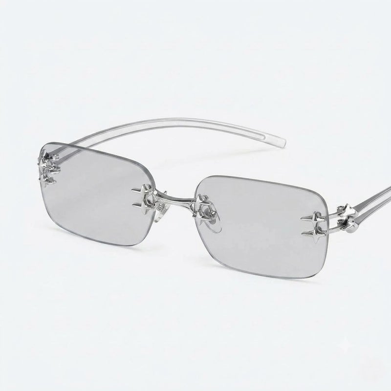 جنتل مونستر نظارات شمسية مستطيلة بدون إطار من Gentle Monster Tetra Col.02 59 مع أذرع معدنية مزينة بنجمة - رمادي فاتح شفاف - Image 1