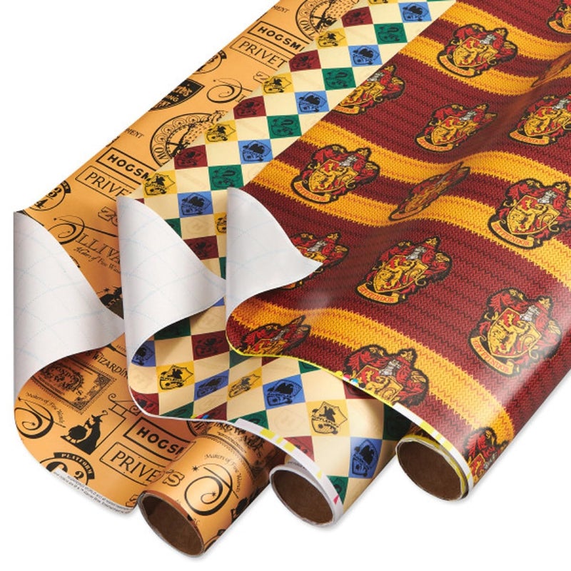 American Greetings 105 sq ft Harry Potter Wrapping Paper Set with Gridlines for Birthdays Graduations and All Occasions Hogwarts House Crests Gryffindor Robe and Marauders Map 3 Rolls 30 in x 14 ft each