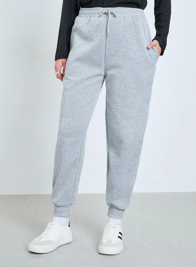 Styli  Solid Cuffed Wide Leg Joggers for Women | Best Price UAE