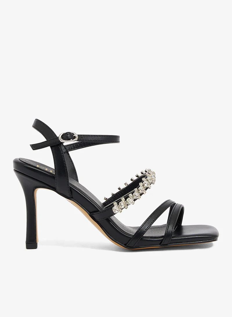 Black sandal with crystal strap, ankle buckle, and three thin straps
