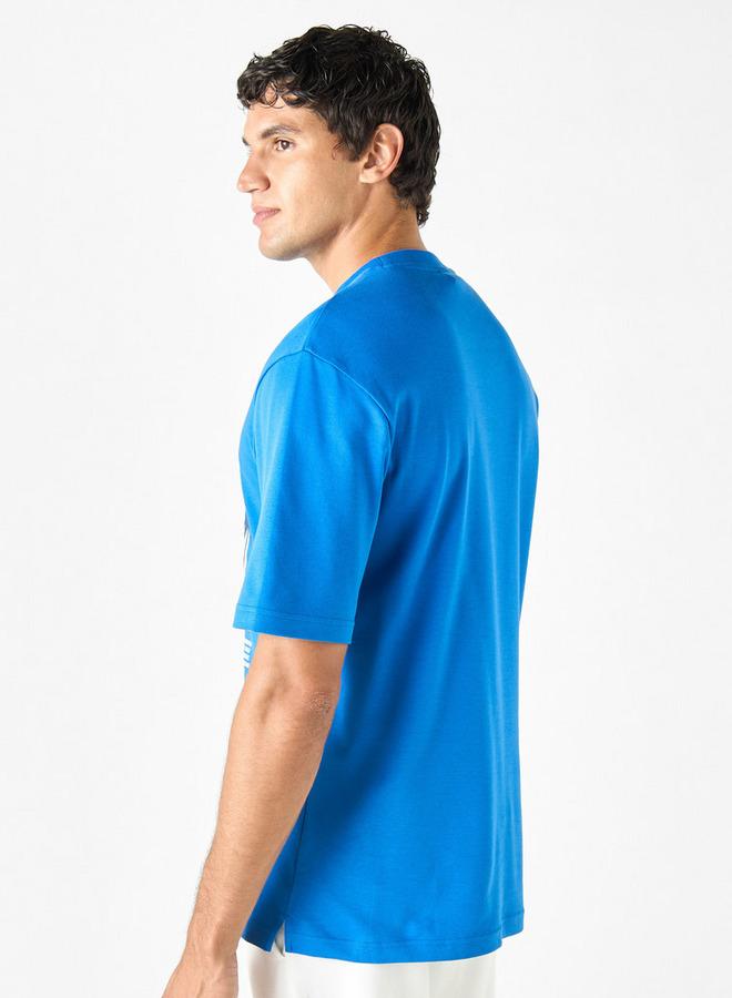 كابا تيشيرت بطبعات جرافيك بياقة ضيّقة وأكمام قصيرة من كابا - Image 3