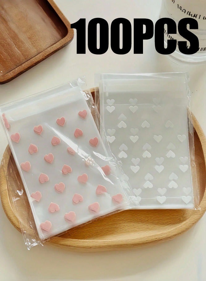 ميدي ١٠٠ كيس سيلوفان قابل لإعادة الإغلاق للبسكويت والوجبات الخفيفة، أكياس بلاستيكية لخبز البسكويت والحلوى (١٠×٨ سم)، أكياس OPP ذاتية اللصق مزينة بقلوب وردية وبيضاء، أكياس إغلاق آمنة غذائياً، أكياس تغليف هدايا حفلات لطيفة للبنات - Image 1