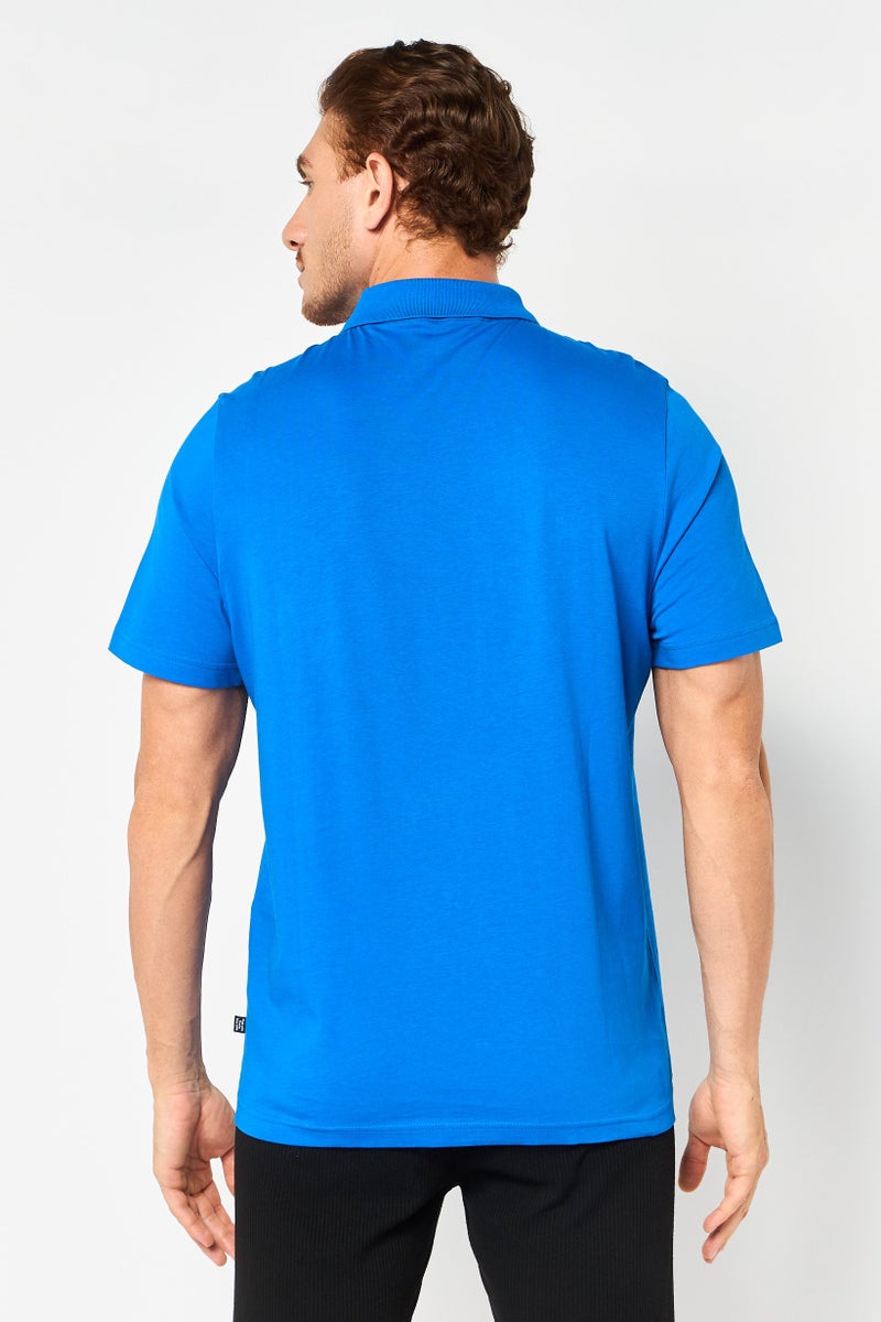 PUMA تي شيرت بولو للرجال بأكمام قصيرة لياقة رياضية بشعار العلامة التجارية، أزرق - Image 3