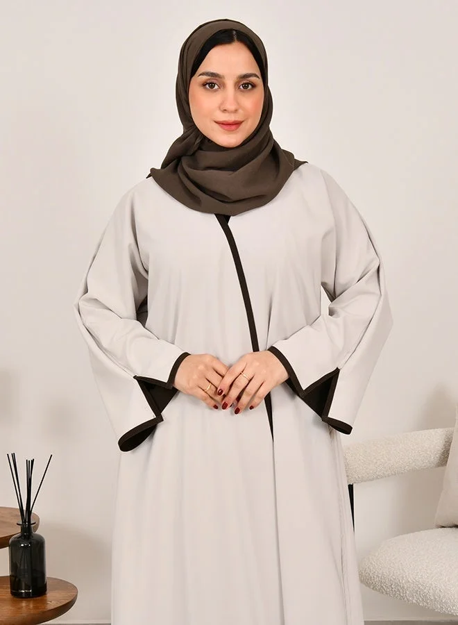 HAWRAA ABAYA Double-faced wrap abaya in off-white and dark brown