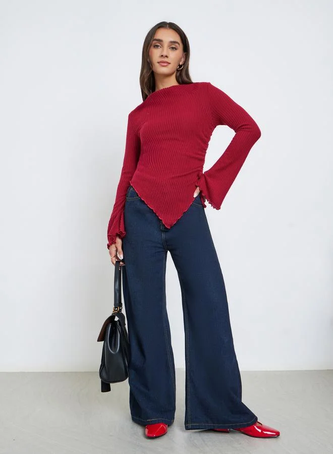 ستايلي بلوزة مضلعة بحافة غير متماثلة الطول وأكمام طويلة