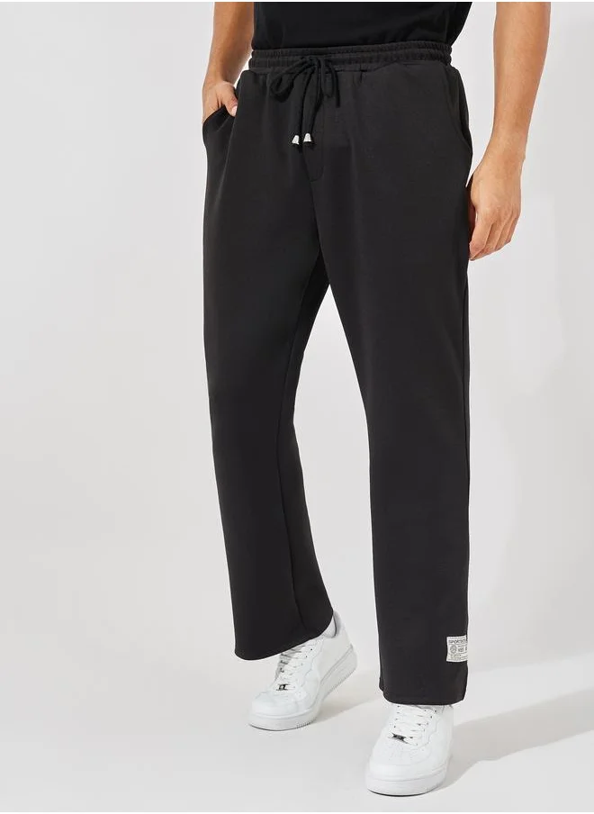 ستايلي Styli Premium Bootcut Scuba Joggers with Badge Detail