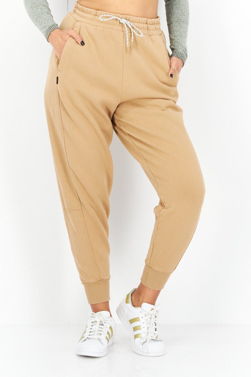 PUMA Women Sportswear Fit Training Jogger Pants, Tan  - Image 1