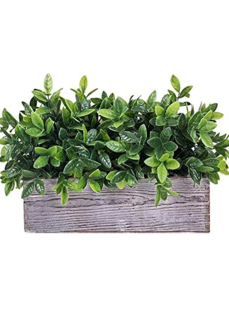 Artificial plant in a wooden basin