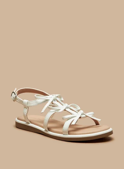 فلورا بيلا من شو إكسبرس Girls Bow Accent Flat Sandals with Buckle Closure