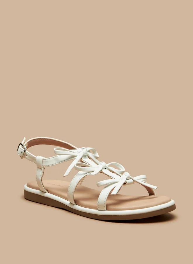 فلورا بيلا من شو إكسبرس Girls Bow Accent Flat Sandals with Buckle Closure