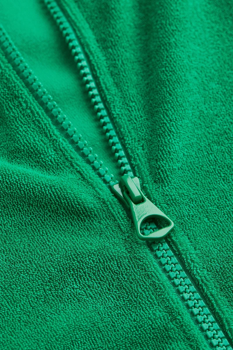 اتش اند ام جاكيت رياضي بقصّة مريحة من قماش تيري