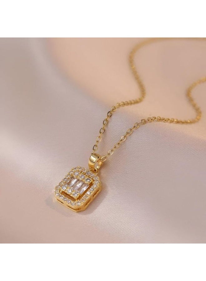 Luxuria The Baguette Pendant features a modern design that combines simplicity and luxury. The pendant consists of a central stone or a group of stones in a rectangular baguette setting, surrounded by a frame of small, shimmering stones that create a halo effect, enhancing its brilliance and visual impact. - Image 3
