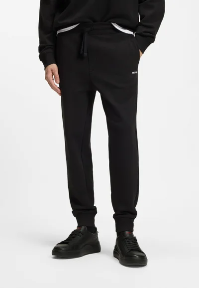 هوجو Cuffed tracksuit bottoms in cotton terry with logo print