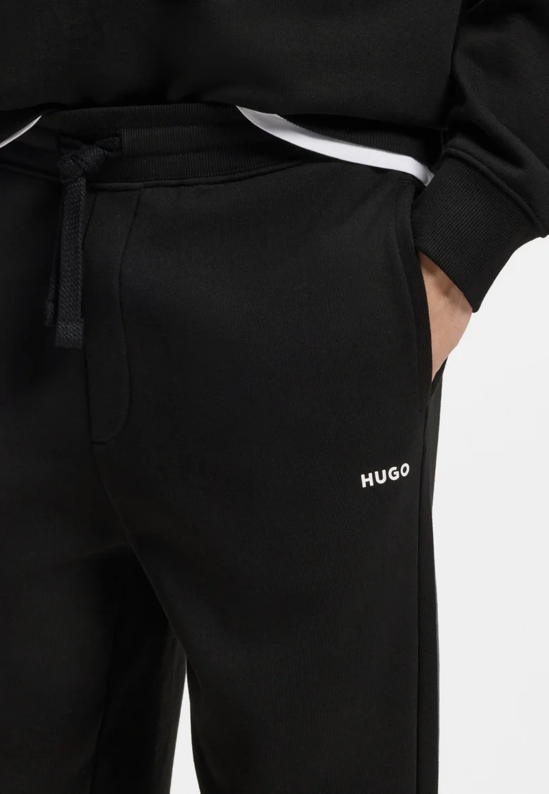 HUGO Black Cuffed tracksuit bottoms in cotton terry with logo print for Men | Best Price UAE