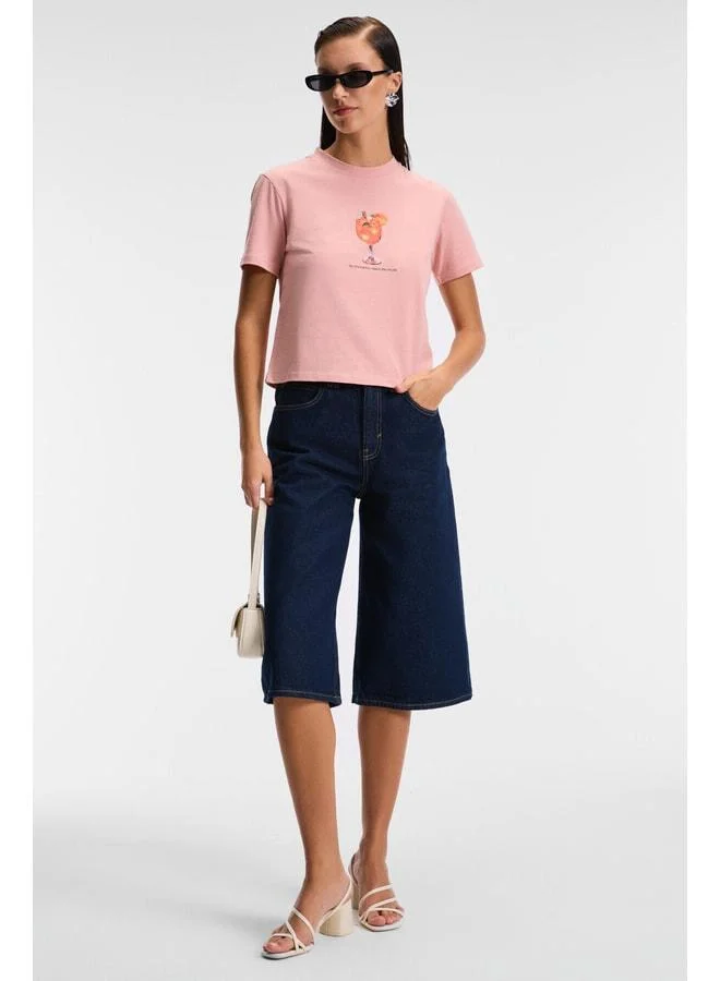Grimelange IVONNE Women's Cocktail Print Short Sleeve Organic Cotton Bike Neck Crop Pink T-Shirt.