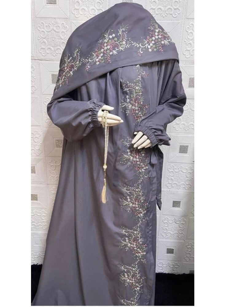 Women's embroidered prayer garment with a modern design.