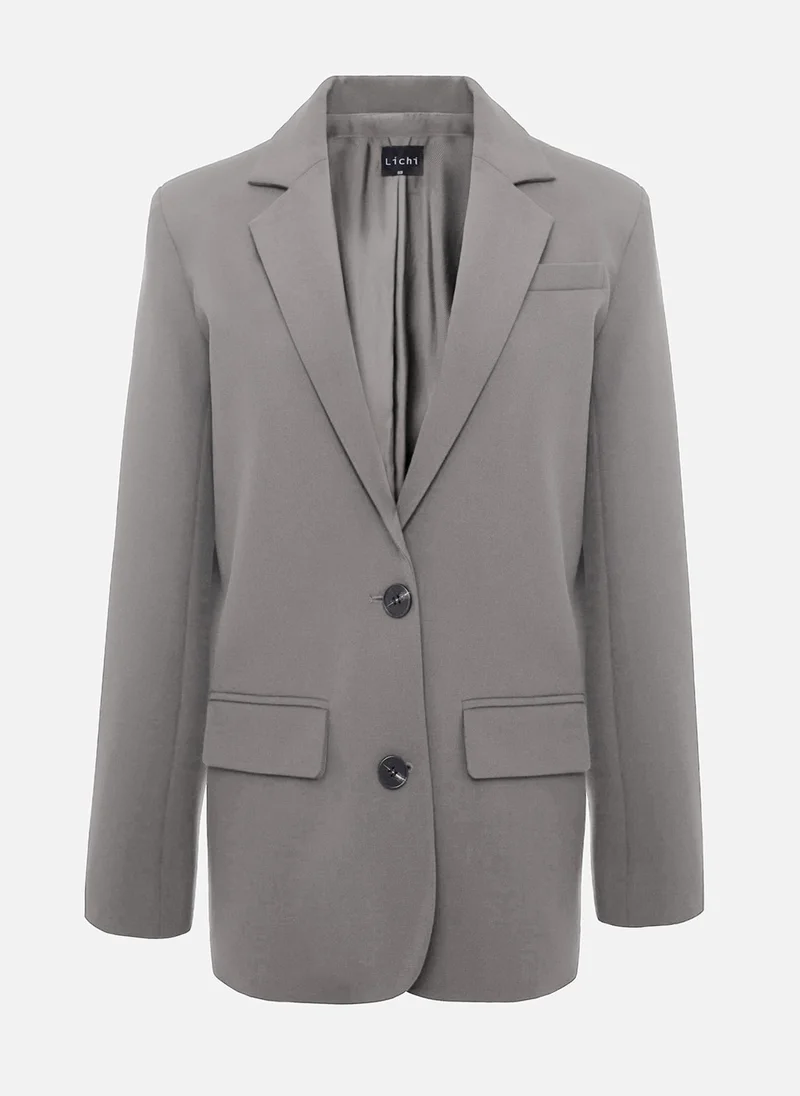 ليتشي سترة أحادية الصدر بأزرار متباينة