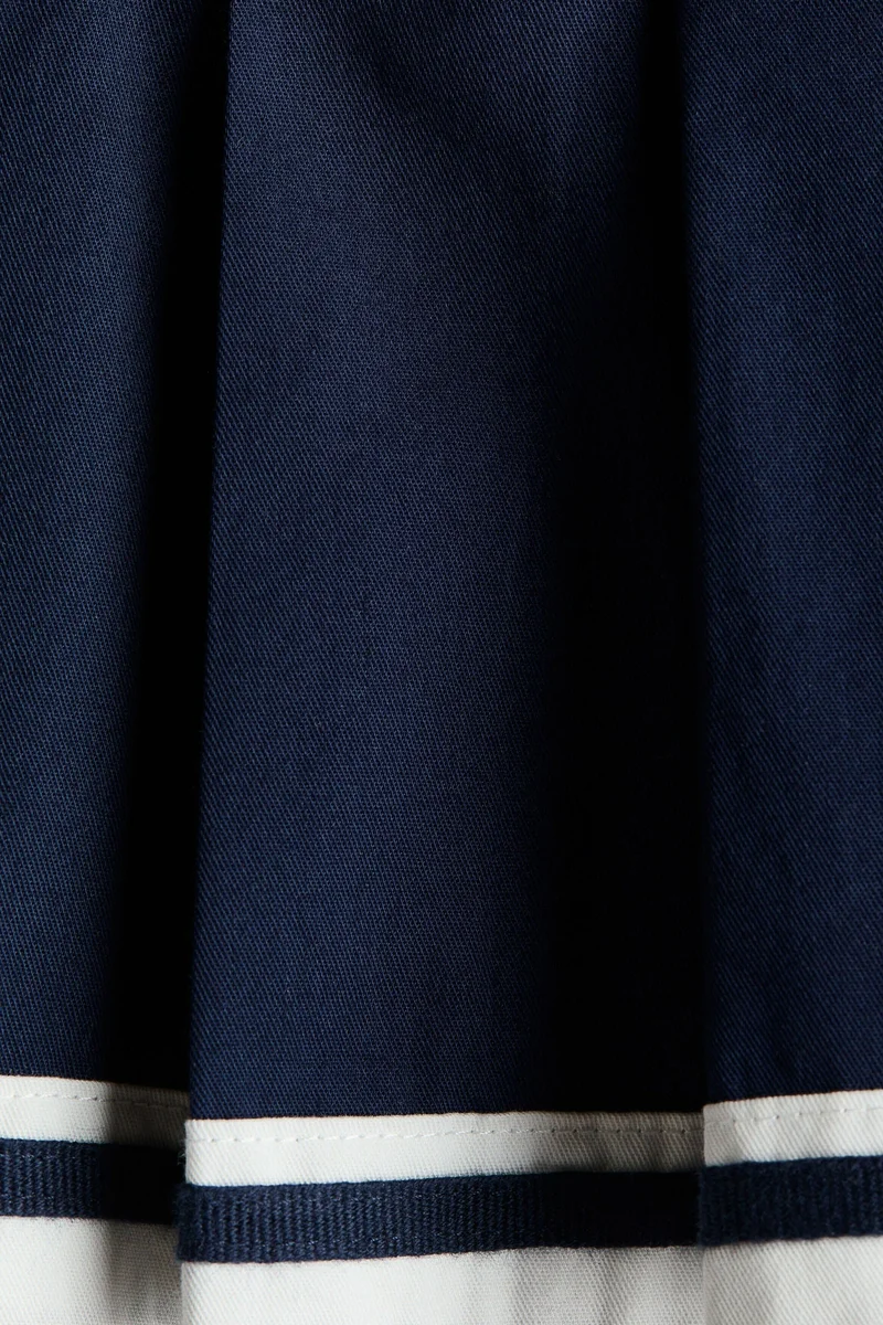 اتش اند ام تنورة بكسرات من تويل قطني